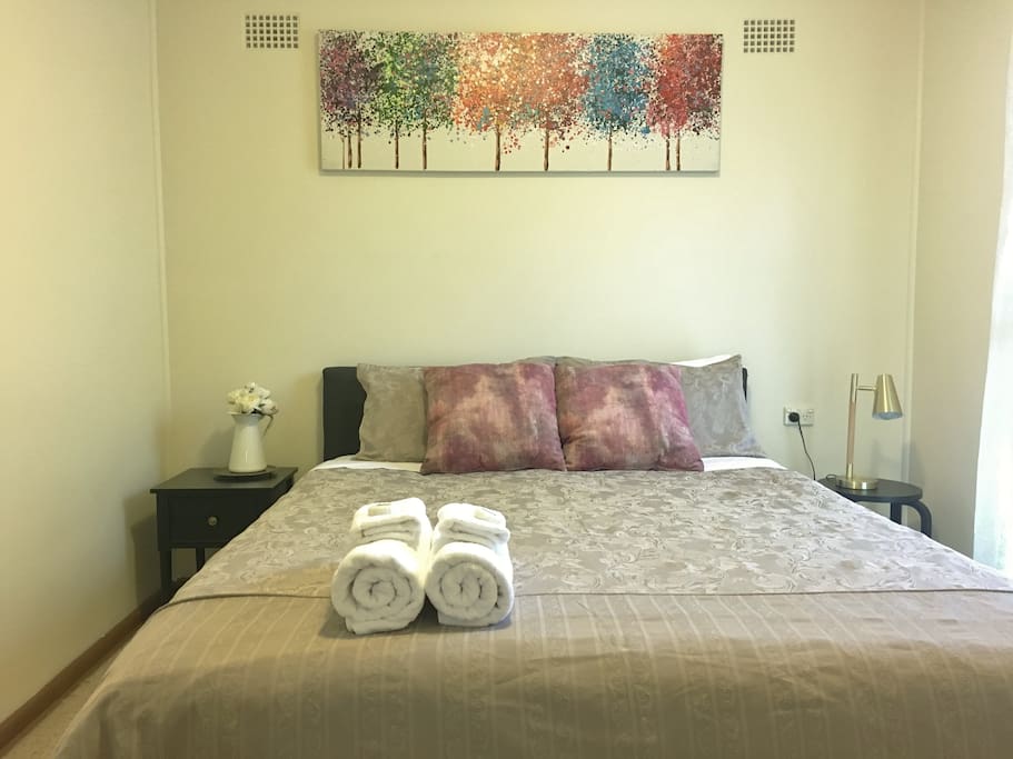 Bedroom - one queen bed with two bedside tables