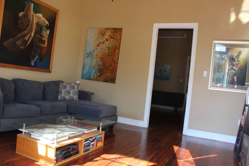 Living room with a very comfy couch that sleeps one.