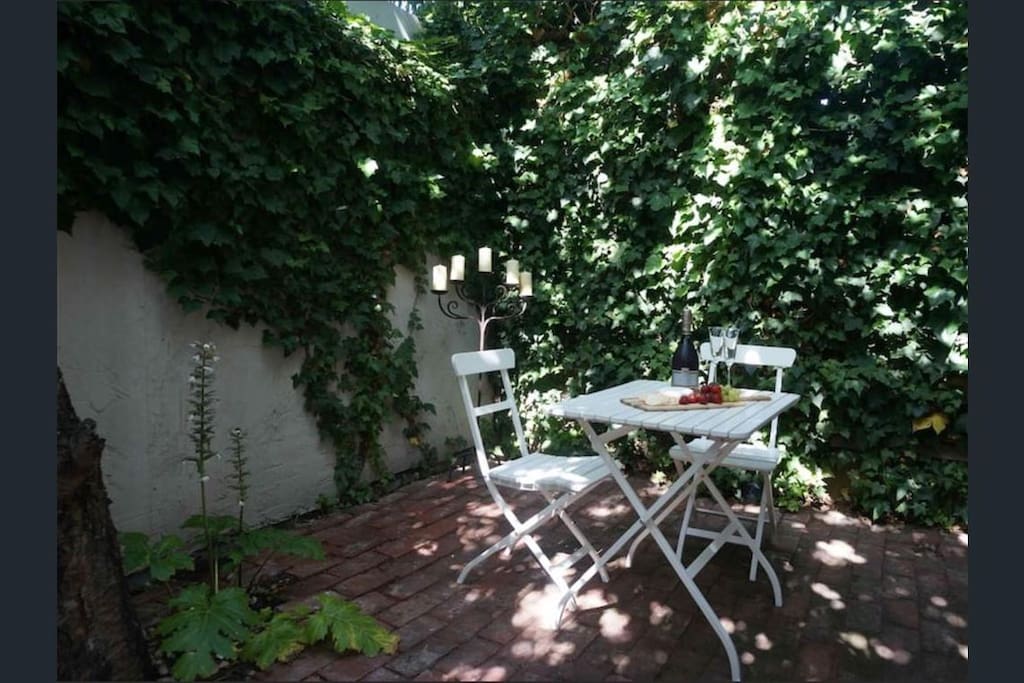 Your own private courtyard for a lazy brunch or a glass of wine in the dappled sunlight.