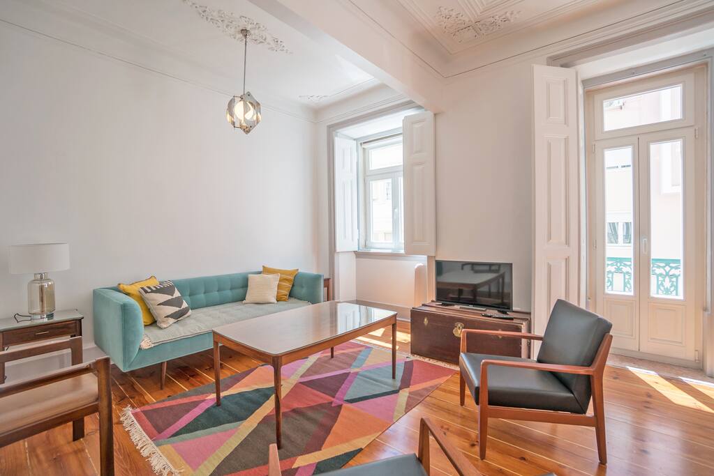 Spacious Living Room with Comfortable Sofa and Arm Chairs