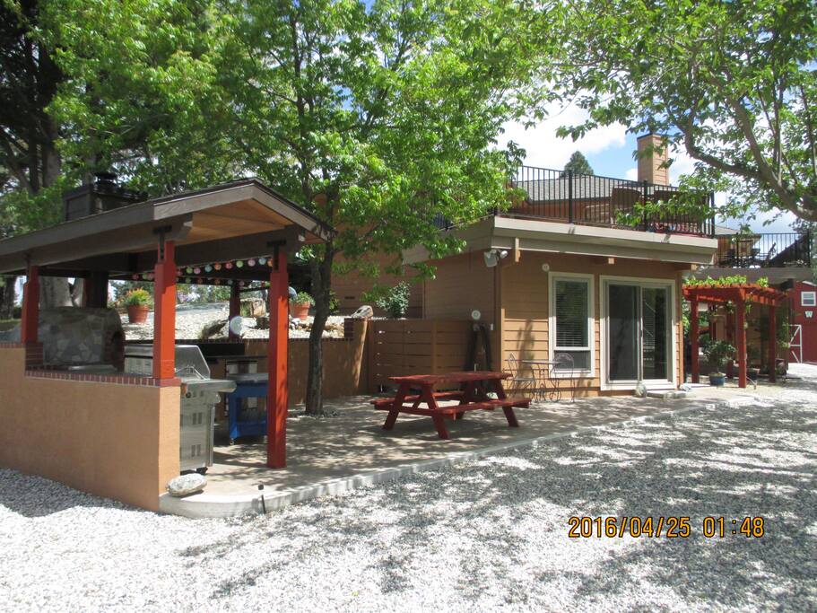 Outdoor kitchen next to the room.