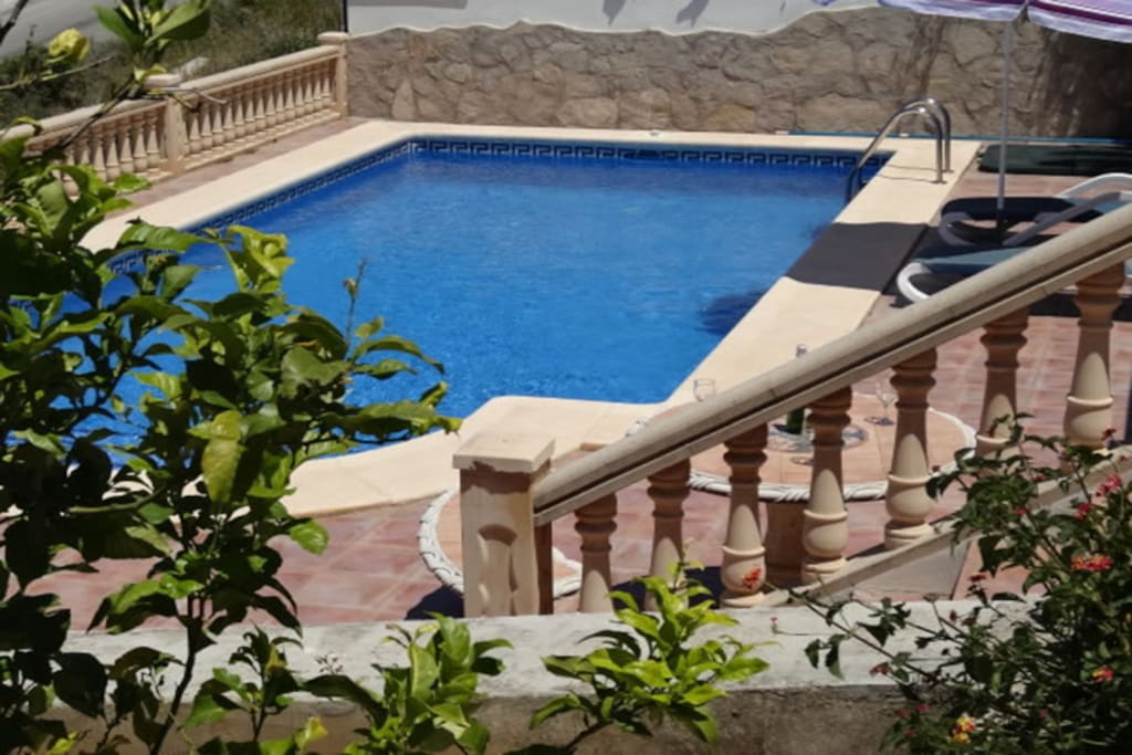 steps from the upper terrace to the pool area.