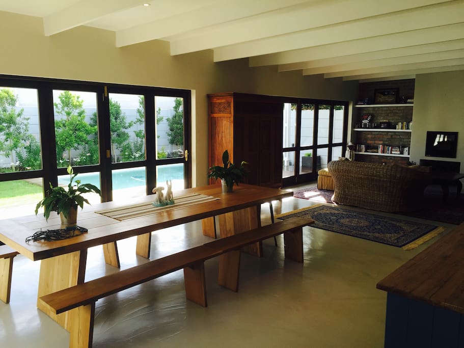 Open plan kitchen and living area flow to outside deck