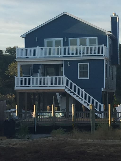 Back of house. Two balconies with views of lagoon. Dock for up to 40 foot boat