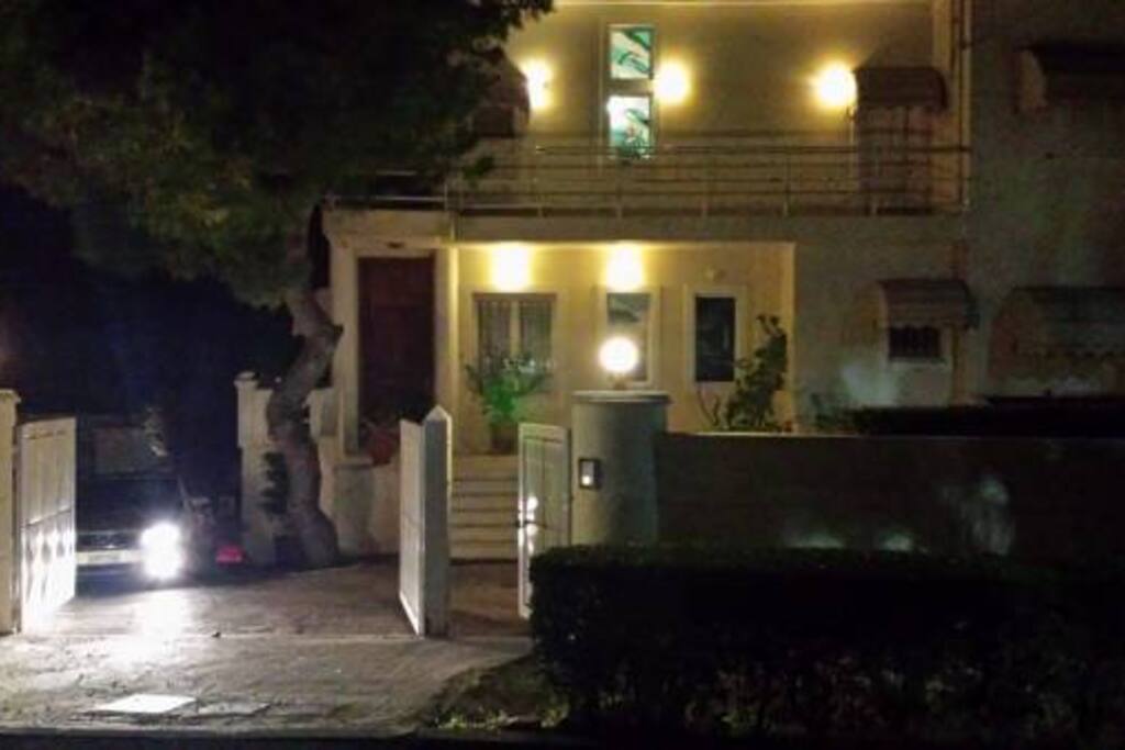 The front of the house at night.