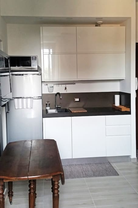 The kitchen is fully equipped with dish machine, induction stove for fast cooking, microwave, nespresso coffee machine