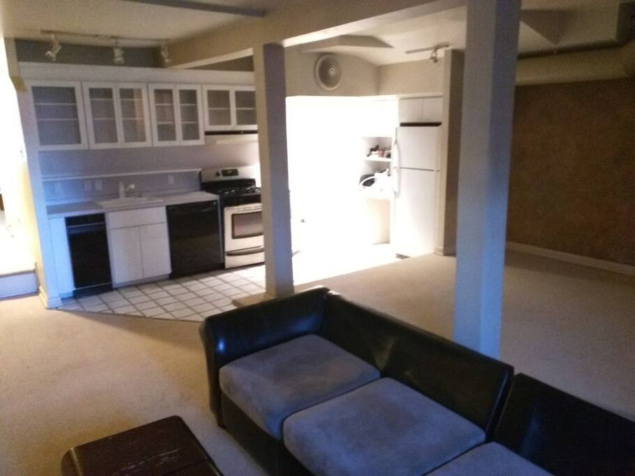 View of living room and kitchen.