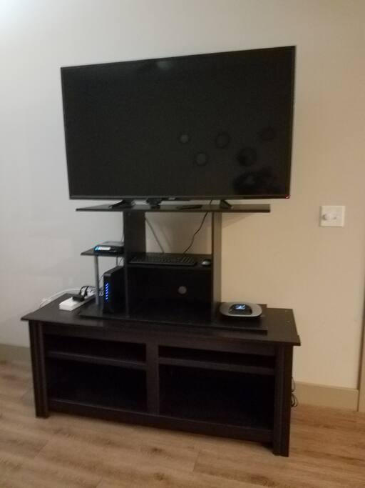 Sweet office setup conveniently located in the living room complete with 50" Chromecast TV, 300 mbps High Speed Internet, video conference box, speaker/microphone, I5/I7 Computer, multiport power strip including USB charging ports and wireless mouse/keyboard.