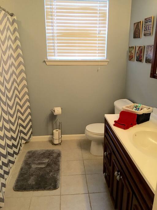 Spacious bathroom with complimentary toiletries.