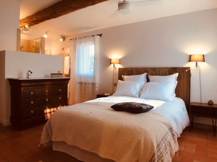 First floor: the Suite (double bed), with a chest of drawers and a shower room area (in the background)