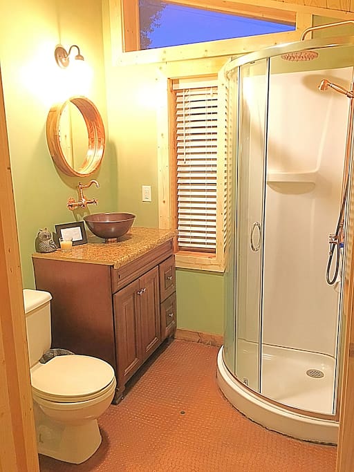 3 Piece bathroom with unique coper penny floor