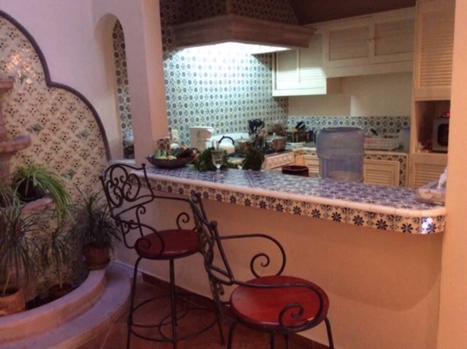 Kitchen with all amenities needed to make your own meals. Breakfast bar too.