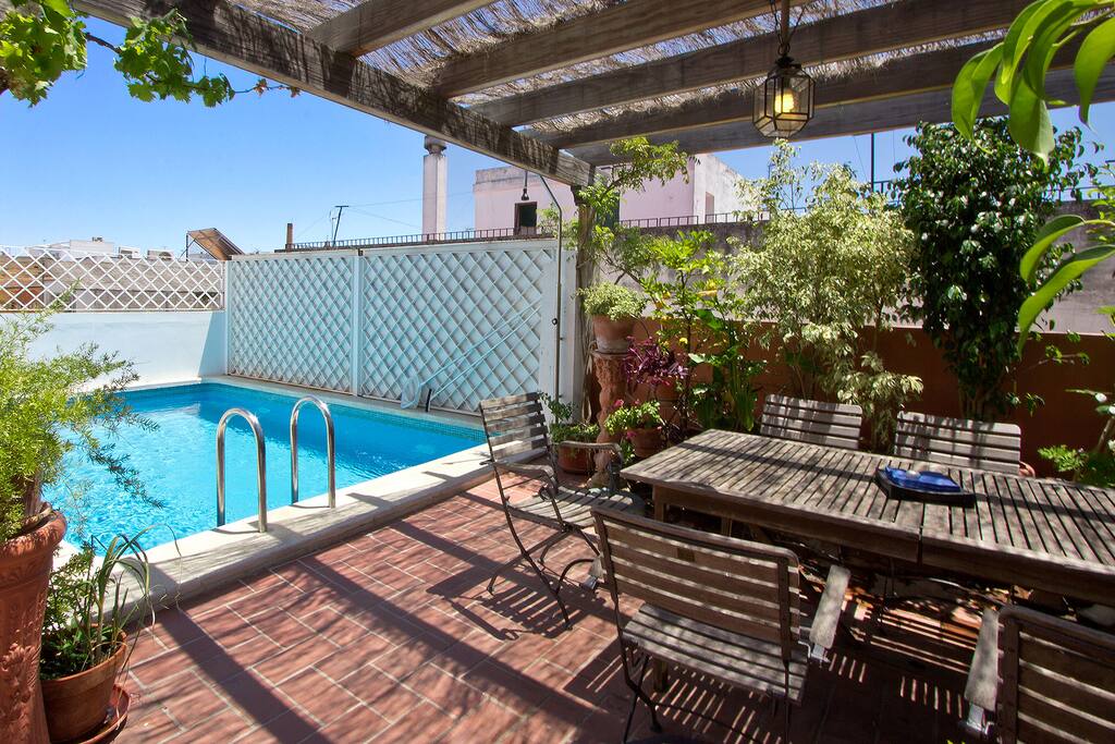 There is an inviting, shaded, eating area and pool on the lower terrace.
