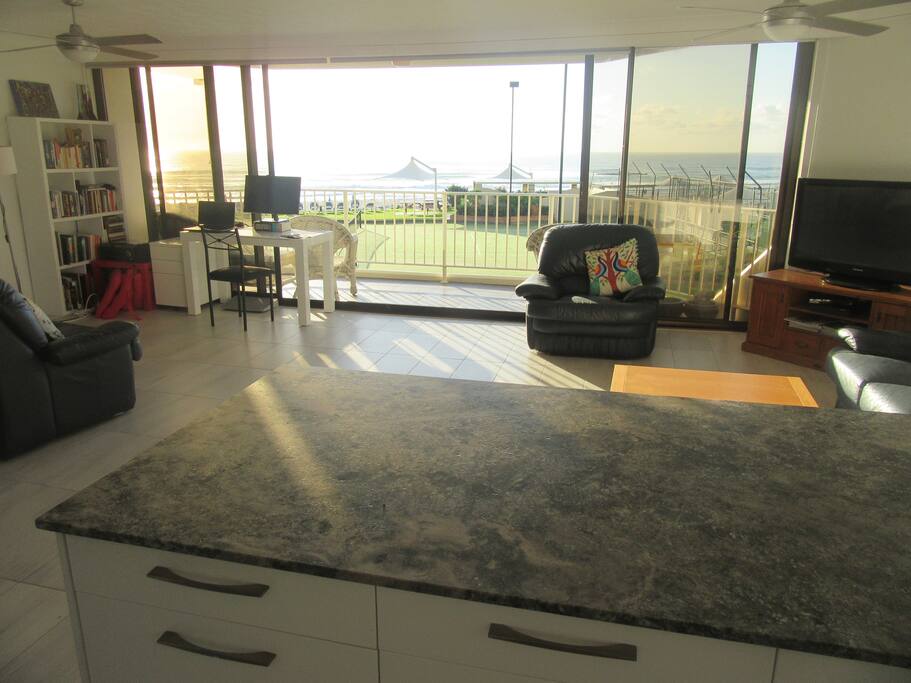 Large open plan living area looking directly into the ocean