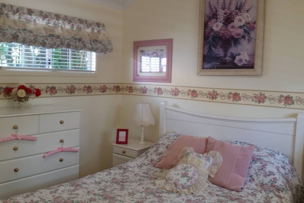 Comfortable bed with pretty linen