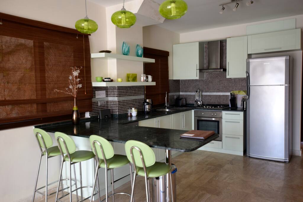 Open plan kitchen with breakfast bar