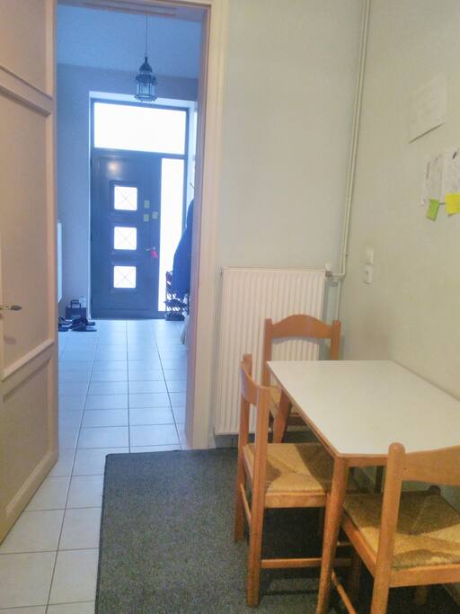 Dining table at kitchen and the entrance of the house. Your room will be at left side when we look from this photo.