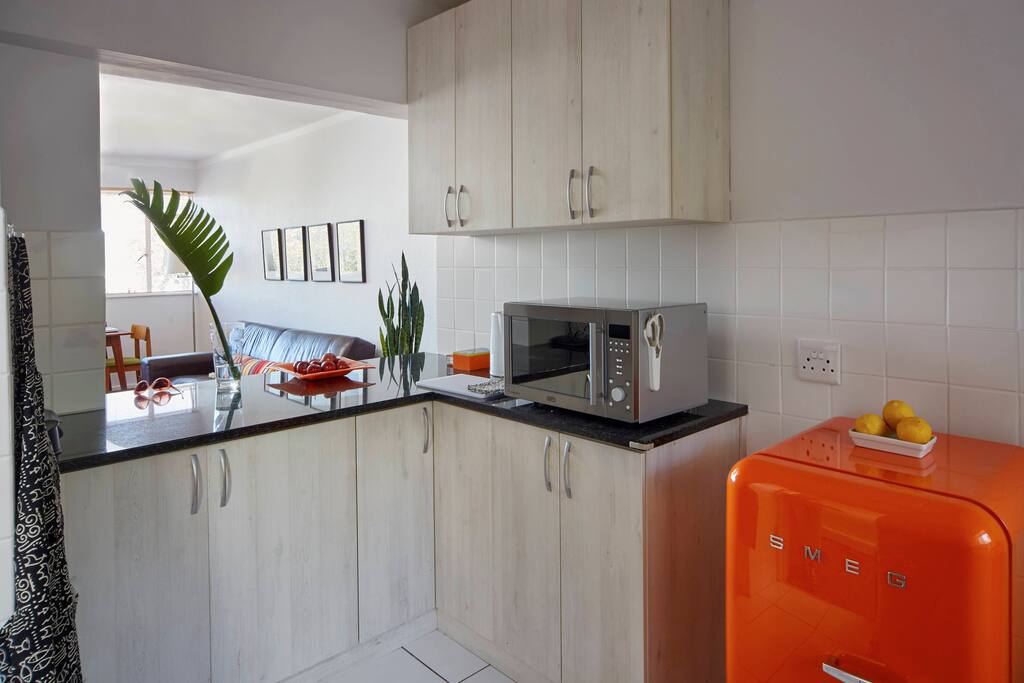An orange Smeg fridge to keep your snacks in