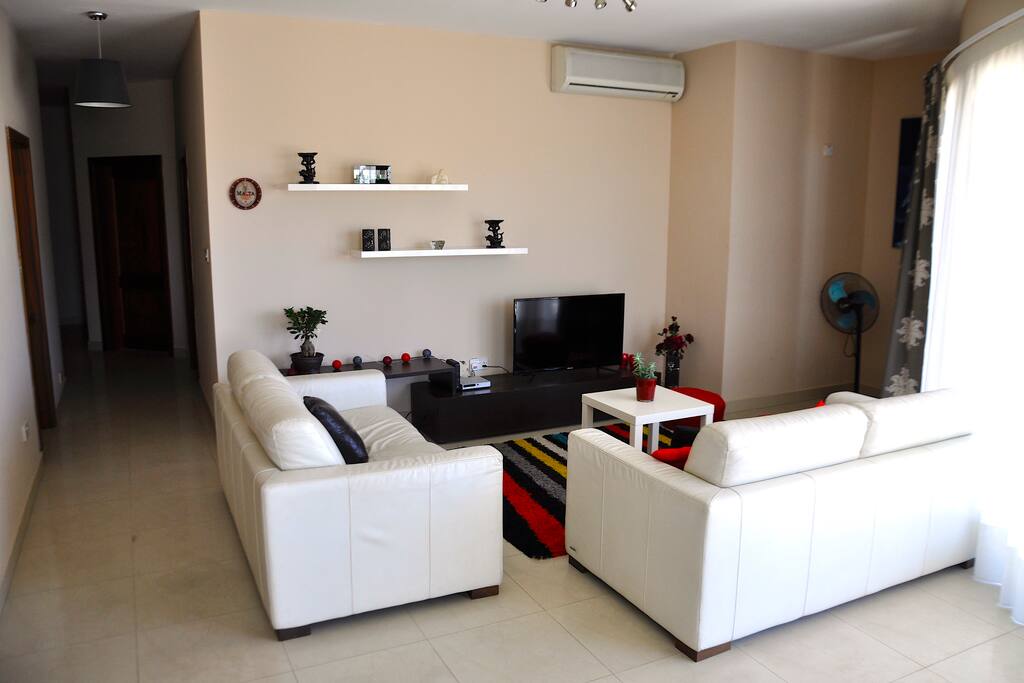 Spacious Living area with full leather sofa.