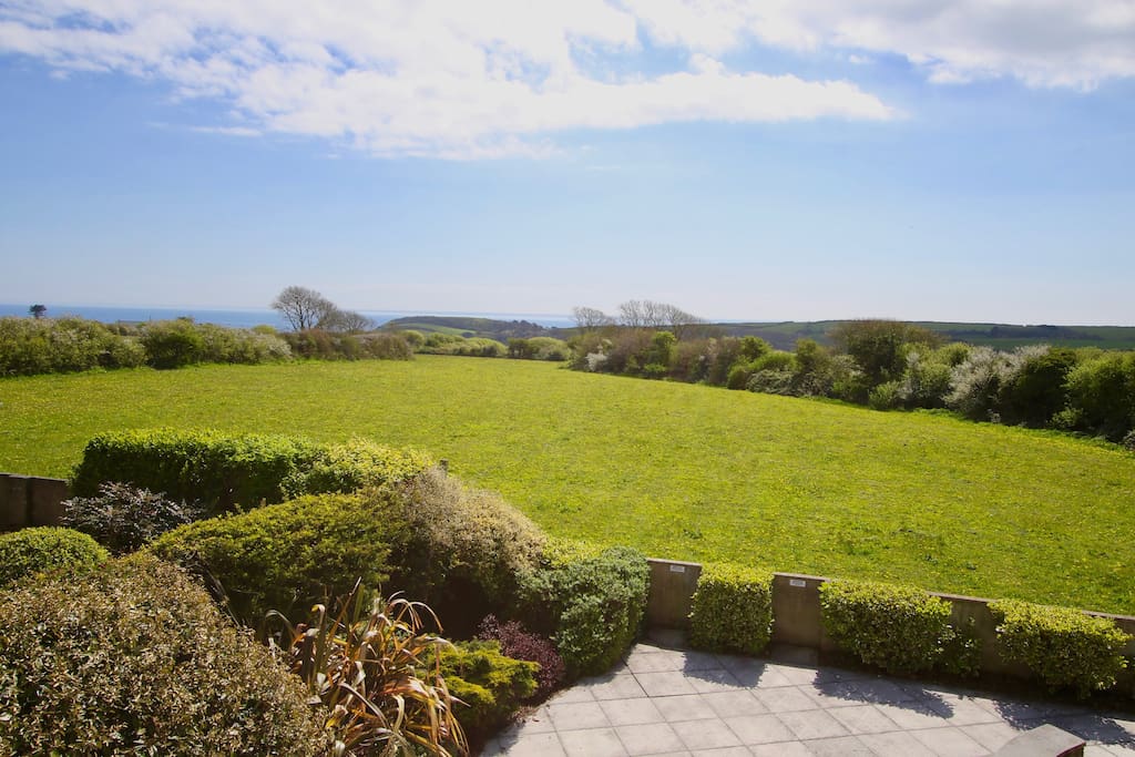 The view from the cottage across fields to the sea!