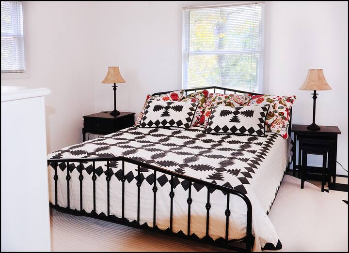 The king-sized bed is brand new and has a comfortable mattress with Pottery Barn bedding.