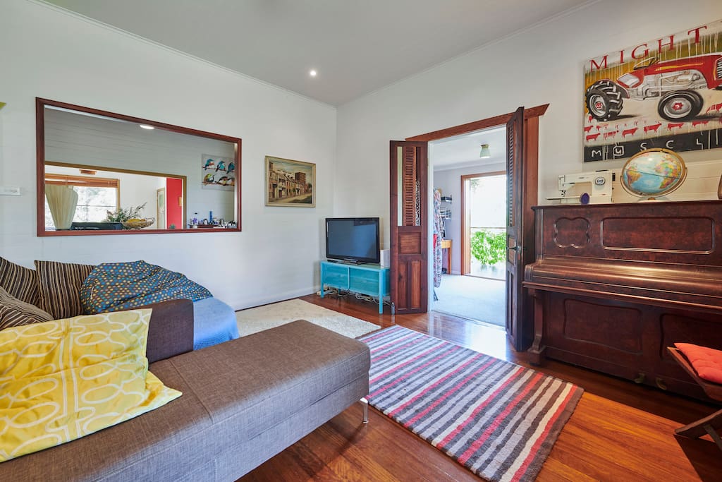 Comfy TV area restored with retro charm.