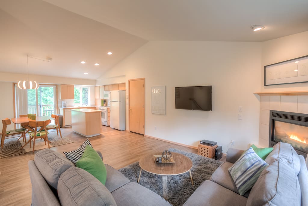 Living room looking onto kitchen and dining area