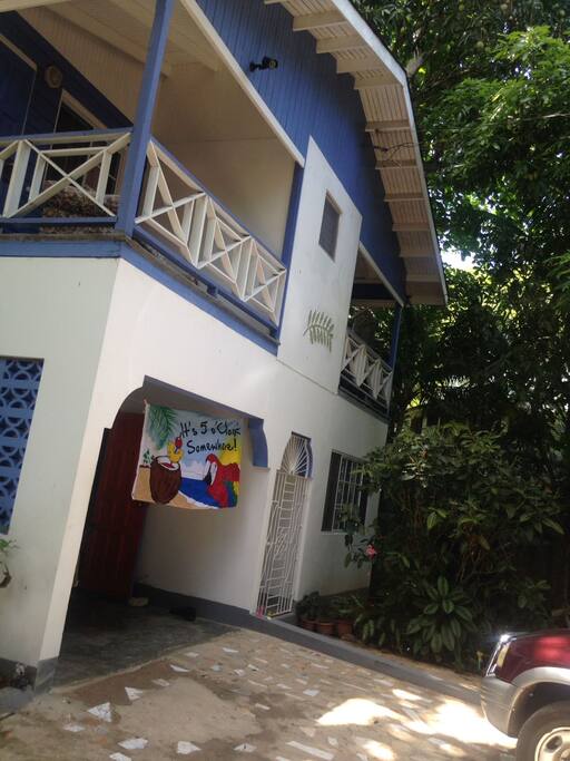 Another view of our house, 5 balconies. On the outside accompanied by lush trees, including: mango, apple and many more.