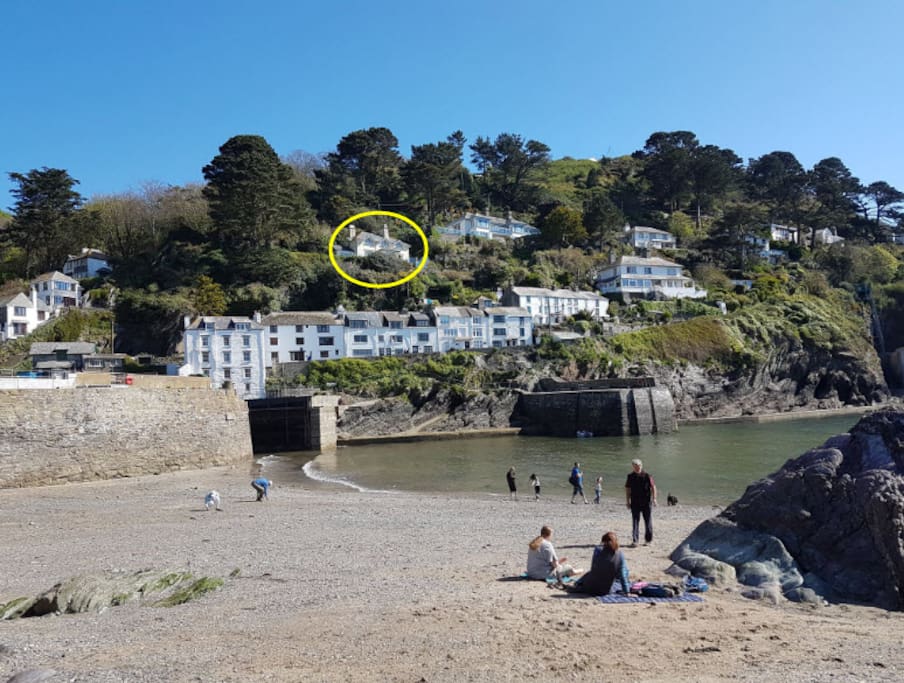 The house circled in yellow viwed from the beach
