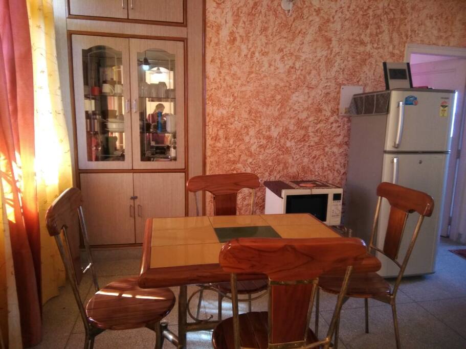 Dining area with microwave and refrigrator.