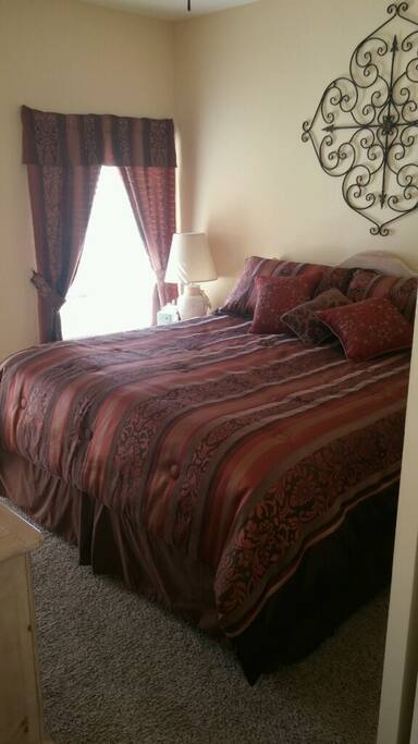 Queen size bed in bedroom