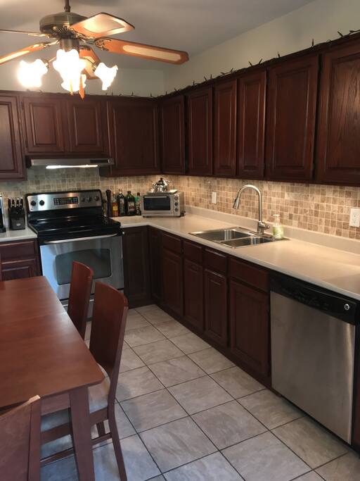 …functional with all appliances. Flooring is ceramic and cupboards are oak.