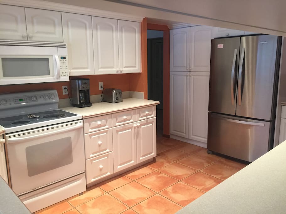 Nicely appointed kitchen with pass through window to back patio