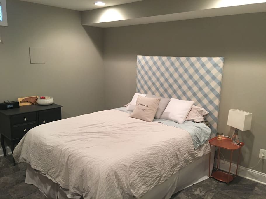 Queen size bed in lower bedroom