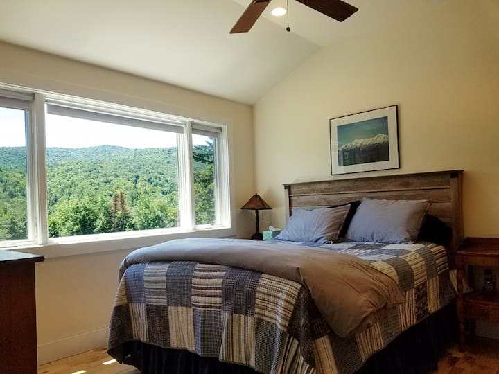 Primary Bedroom with 180 Degree Mountain Views and a Queen Bed