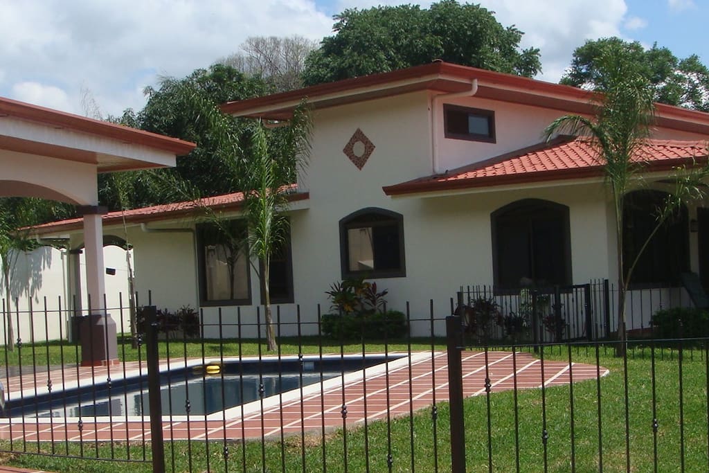 Pool, with View of the side of the House