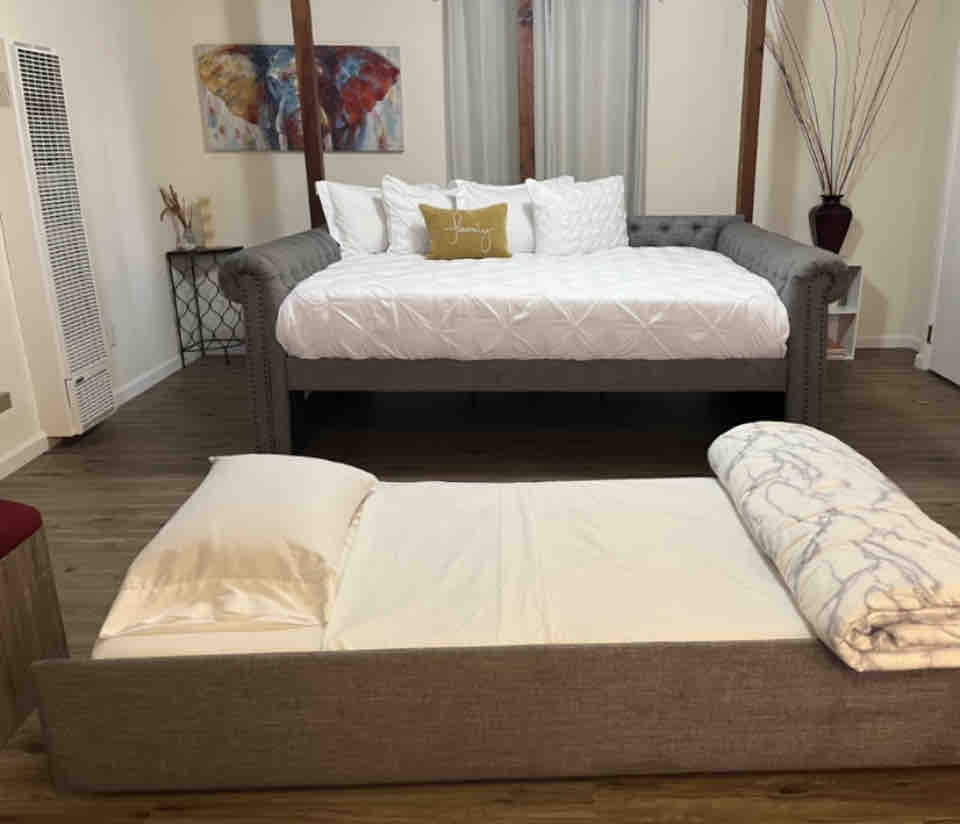 Queen daybed with twin trundle all set up and ready for you to use.