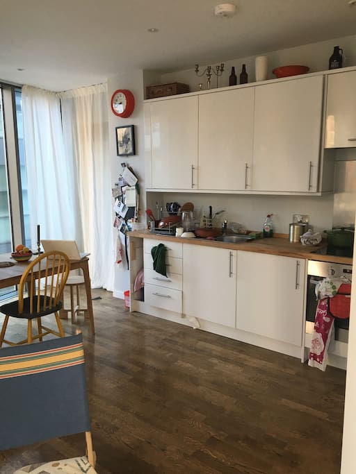 Kitchen/ living room. Kitchen table seats 6 comfortably, and kitchen is fully equipped with cutlery, pots, pans, basic herbs/spices and BOSE sound system that operates through WIFI