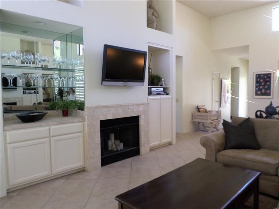 Living room with flat screen and bar area