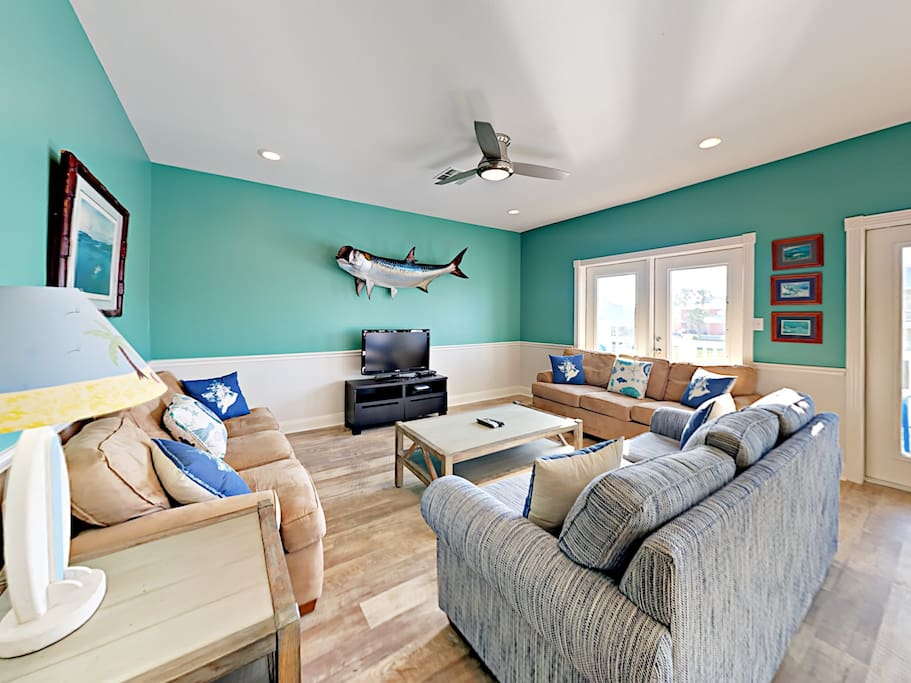 Seating for 9 in the living area with 3 inviting couches.
