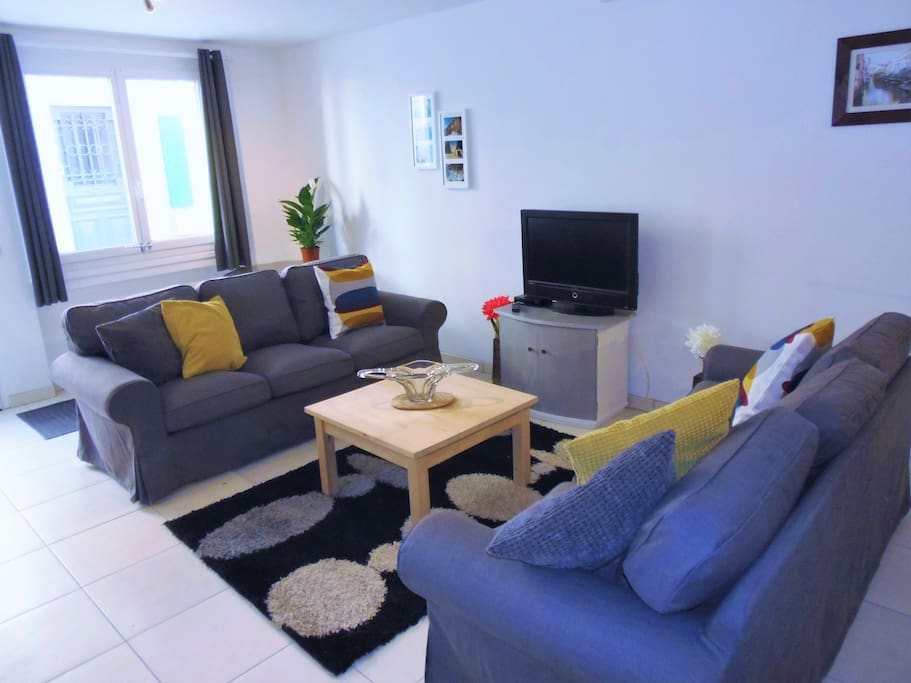 Bright lounge with comfortable sofas and UK FreeSat