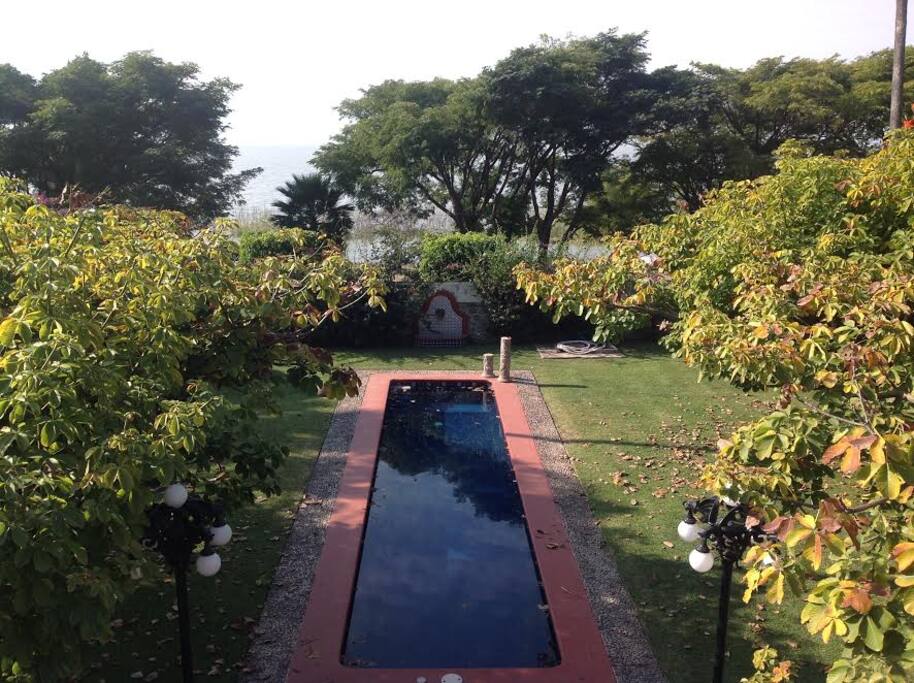 View from the balcony of the pool and the lake, right in front of the house.