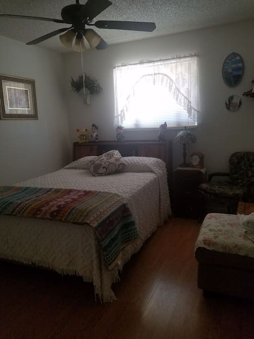 The bedroom with queen bed and closet.