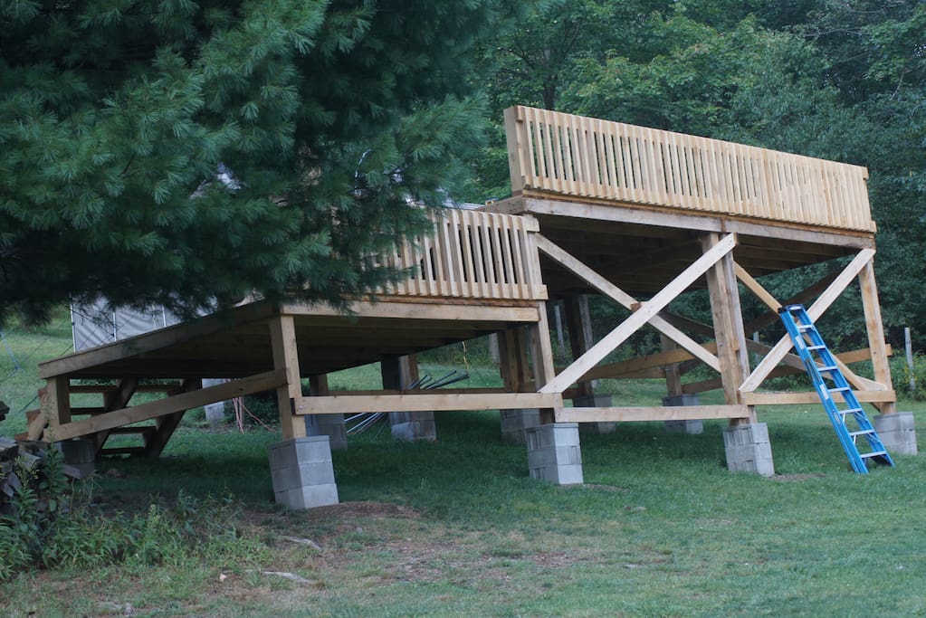 Two large decks,the top one has a canopy over it to provide shade or rain protection with a pic-nic table available