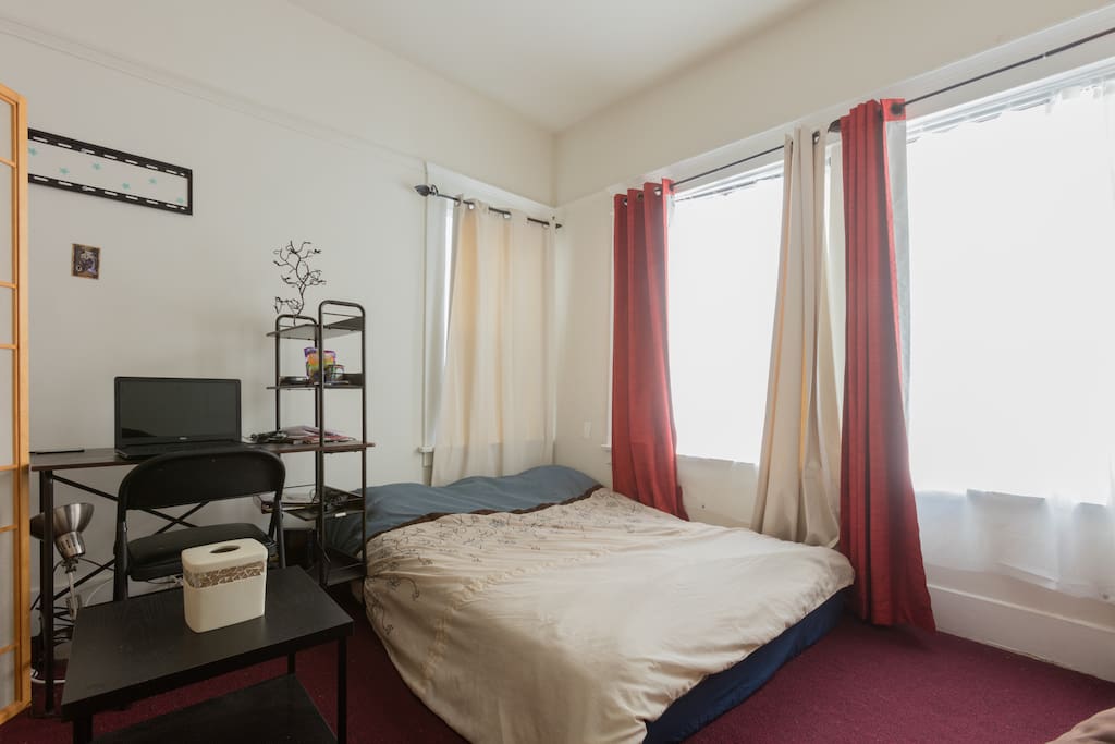 Bed 1 of 2 in room...laptop, wifi , desk , chair, lamp, & mini table for food, drinks, etc