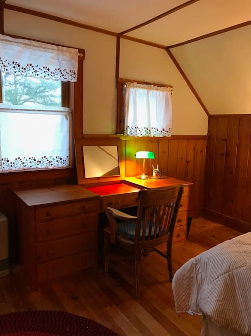 Built-in desk faces the Damariscotta River. The desk-top opens up to a vanity mirror.