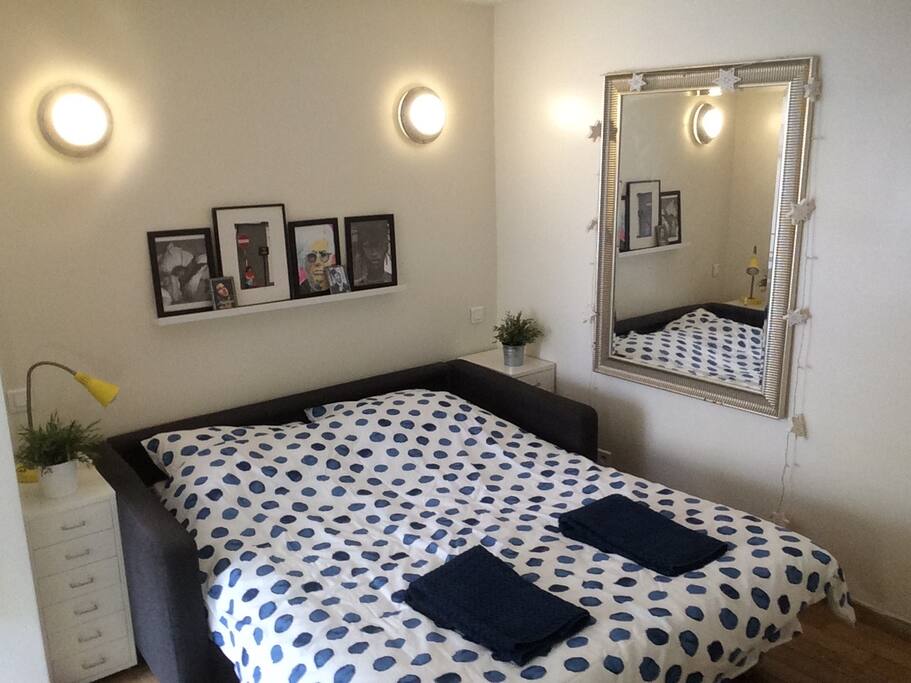 Sofa bed opened with shower towels provided