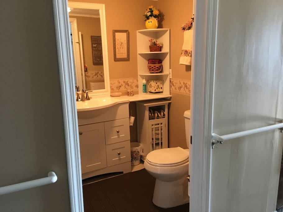 Bathroom has lots of towels and all the things you need.