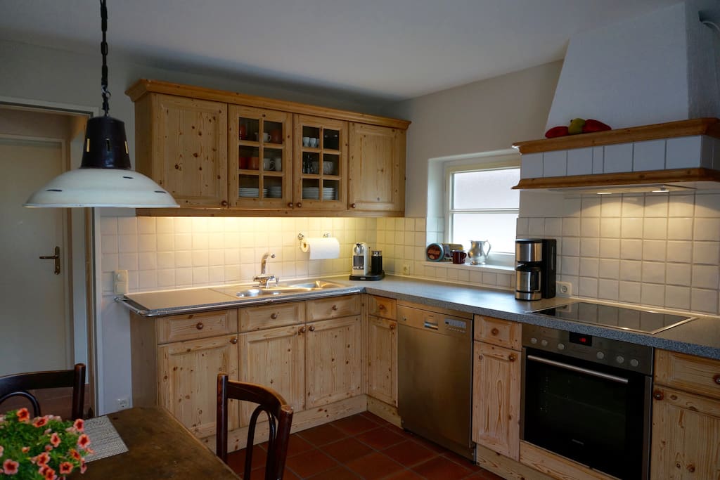 Kitchen with dishwasher, stove, oven, coffee machines