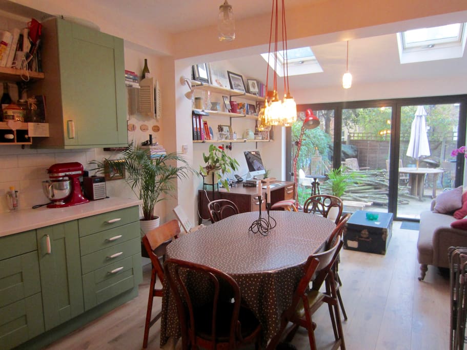 Bright and airy kitchen-dining room with direct access to a private garden